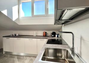 a kitchen with a sink and a window at Casa Carletti in Chivasso +6 photos