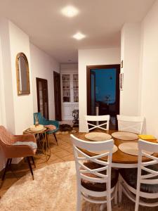 a dining room with a table and chairs at Andrei's house in Sinaia