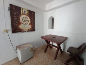 a small table and a chair in a room at The Relax Resort in Ko Phangan +28 photos