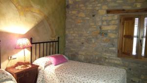 Postel nebo postele na pokoji v ubytování Apartamentos La Borda Castillon