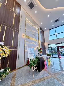 a lobby of a building with a sign on the wall at Phú Tài Central Life in Quy Nhon