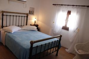 Postel nebo postele na pokoji v ubytování Villa Mantalena