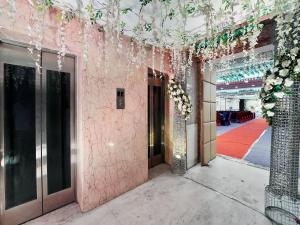 a hallway of a building with flowers on the ceilings at Palette Orient Hotel & Convention Centre by CheckIn, Nagpur in Nagpur