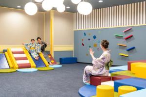 a childrens play room with colorful furniture at Ooedo Onsen Monogatari Premium Shima Saichoraku in Shima