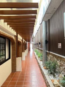 an empty hallway of an office building with awnings at Casa Aya Suites in Puerto Galera
