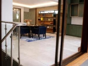 a kitchen and dining room with a table and chairs at 13 on Tenth in Walmer