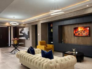 a living room with a couch and a fireplace at 13 on Tenth in Walmer
