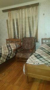 Katil atau katil-katil dalam bilik di Archil and Nino Gigauri Guest House