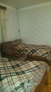 Katil atau katil-katil dalam bilik di Archil and Nino Gigauri Guest House