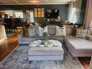 a living room with a couch and a coffee table at 20 in Crescent in Gqeberha