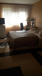 Postel nebo postele na pokoji v ubytování Family Hotel Kartala