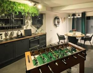 a kitchen with a foos ball on a table at INsight - workcation oldtown in Ingolstadt