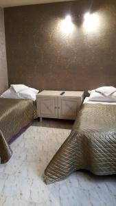 Postel nebo postele na pokoji v ubytování Family Hotel Kartala