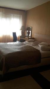 Postel nebo postele na pokoji v ubytování Family Hotel Kartala