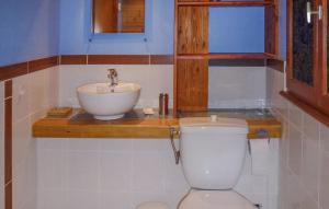 a bathroom with a sink and a toilet at Les Bouyssières in Creysse