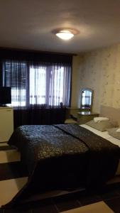 Postel nebo postele na pokoji v ubytování Family Hotel Kartala