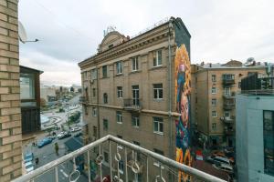 a building with a mural on the side of it at Central Apartments in Kyiv