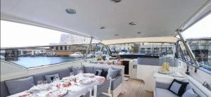a restaurant on a boat with tables and chairs at Private Yacht Monaco in Monte Carlo