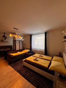 a bedroom with two beds and a window at Apartmán CENTRAL, free parking in Banská Bystrica