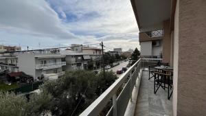 a balcony of a building with a view of a street at rodou 39 apartment in Alexandroupoli