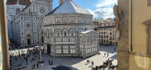 a large building in front of a cathedral at Albergo San Giovanni in Florence