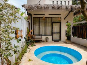 a house with a blue pool in the yard at Chill Tangalle in Tangalle