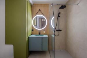 a bathroom with a shower and a sink and a mirror at Slate at Max, Luxury in Mulhouse, Air Conditionné in Mulhouse +15 photos