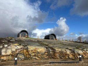 two domed buildings on top of a rocky hill at Hilltop Glamping in Ardara +4 photos