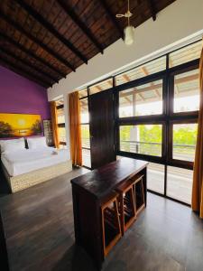 a bedroom with a bed and a large window at Abie Villa in Negombo +82 photos