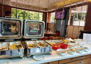 a buffet with many food items on a table at Southern Plaza in Kolkata