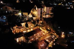 an overhead view of a city at night with lights at Là Yên Retreat in Ấp Ða Lợi