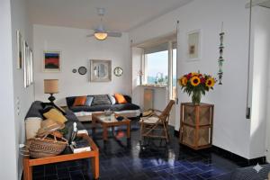 a living room with a couch and a table at Casa Edy mare e spiaggia a Formia in Latina
