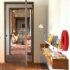 a room with a desk with books on it at Great to stay Gent I rooms & apartments in Ghent