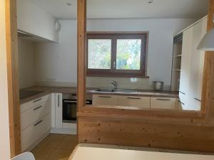 a kitchen with a sink and a window at ANNEXE 1888 in Magland +37 photos