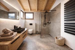 a bathroom with a sink and a shower at Mountain Residence in Going am Wilden Kaiser +26 photos