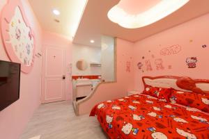 Postel nebo postele na pokoji v ubytování 安可的家 小孩及寵物免費 恆春老街夜市 屏東縣民宿0497