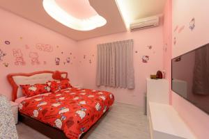 Postel nebo postele na pokoji v ubytování 安可的家 小孩及寵物免費 恆春老街夜市 屏東縣民宿0497