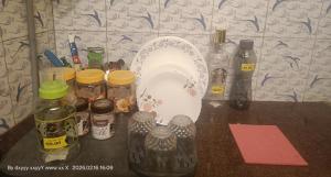 a bathroom counter with a sink and bottles of liquid at Villa Betty Individual 2 Rooms property at beach front Near French colony in Pondicherry +46 photos