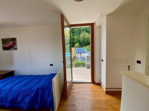 a bedroom with a bed and a large mirror at Refugio Azul Baveno, pool and private parking in Baveno +18 photos
