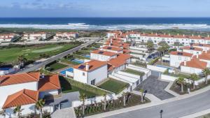 an aerial view of a resort with the ocean at Villa del Rey II in Casal da Lagoa Seca