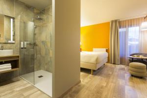 a hotel room with a shower and a bed at SOWELL FAMILY Vars in Vars +50 photos