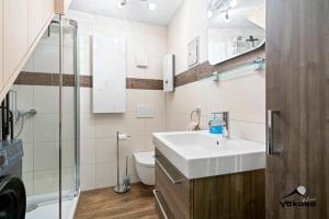 a bathroom with a sink and a toilet at Naabblick in Kallmünz +4 photos