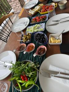 a table topped with plates and bowls of food at Loidevilla in Çamurlu +57 photos