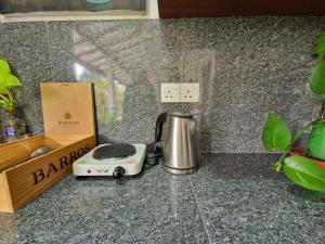 a blender sitting on a counter next to a box at Mango Lodge in Aluthgama