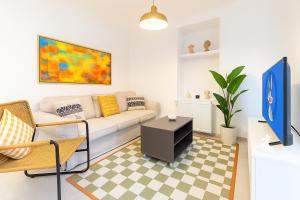 a living room with a couch and a table at Maison Istanbulite in Istanbul