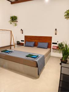 a bedroom with a large bed in a room at bluemoonhiriketiya in Dickwella +20 photos