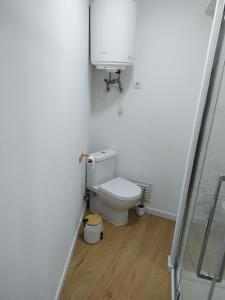 a white bathroom with a toilet and a sink at charnecas house in Gaula +4 photos