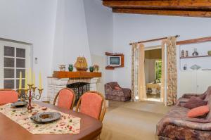 a living room with a table and a fireplace at Holiday Apartment Maria in Orebić +23 photos