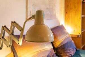 a lamp sitting on a table next to a couch at Das Juwel in Erbach