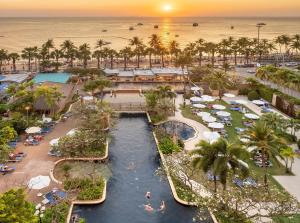 an aerial view of a resort with a pool and a beach at Jomtien Palm Beach Hotel & Resort - Family-Friendly in Jomtien Beach